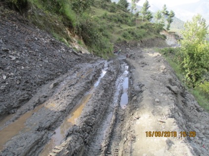 Figure 5.6 Road opening a seep that next damages the road surface (Mugu, Nepal)