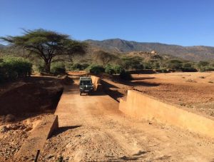 Ethiopia: culvertless road drift combined with sand dam with scope to further raise sand deposition upstream by gradually closing the gap in the side wall