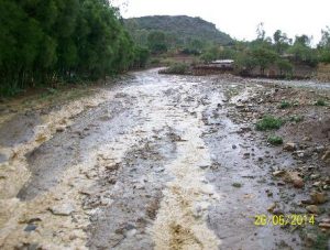 Ethiopia: water damage in action on an unpaved road; note the gully at the end of the slope