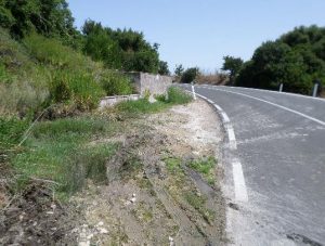 Roadside Spring, Sardinia, Italy: collection reservoir is too small, with overflow water damaging the road